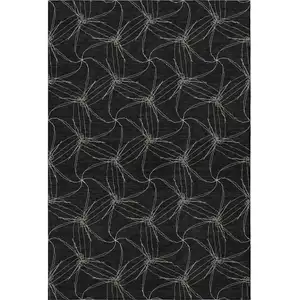 Photo of Black And Ivory Geometric Washable Area Rug With UV Protection