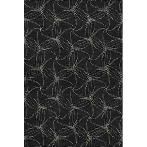 Photo of Black And Ivory Geometric Washable Area Rug With UV Protection