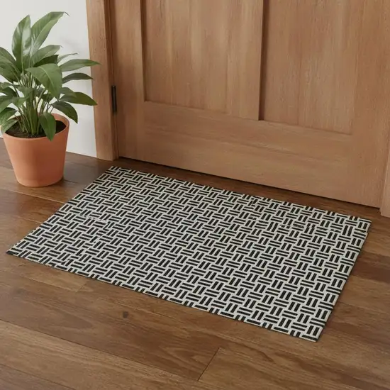 Black And Ivory Geometric Washable Area Rug With UV Protection Photo 1