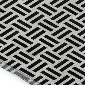 Photo of Black And Ivory Geometric Washable Area Rug With UV Protection