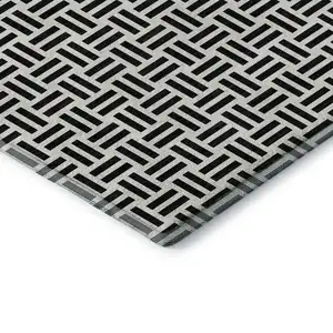 Photo of Black And Ivory Geometric Washable Area Rug With UV Protection