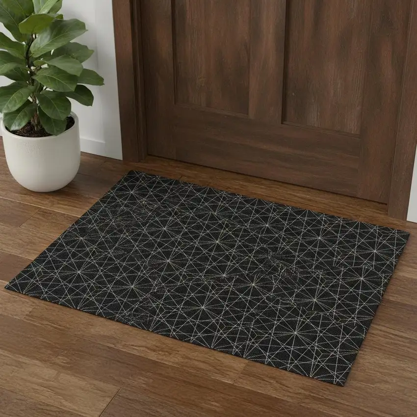 Black And Ivory Geometric Washable Area Rug With UV Protection Photo 1