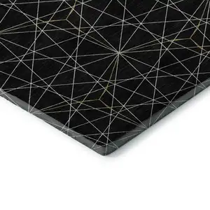 Photo of Black And Ivory Geometric Washable Area Rug With UV Protection