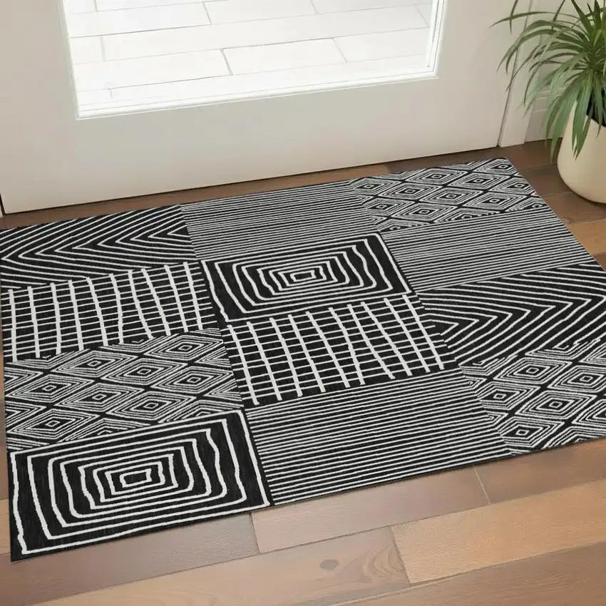 Black And Ivory Geometric Washable Area Rug With UV Protection Photo 1
