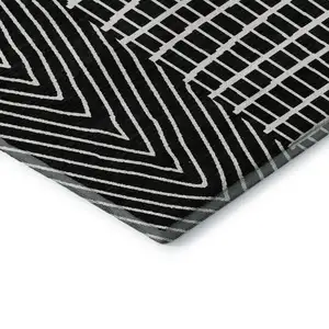 Photo of Black And Ivory Geometric Washable Area Rug With UV Protection