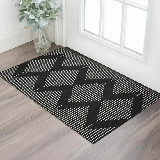 Black And Ivory Geometric Washable Area Rug With UV Protection Photo 2