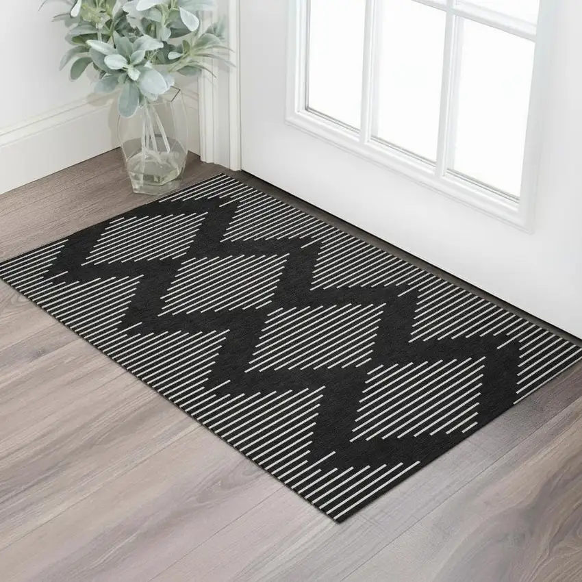 Black And Ivory Geometric Washable Area Rug With UV Protection Photo 2