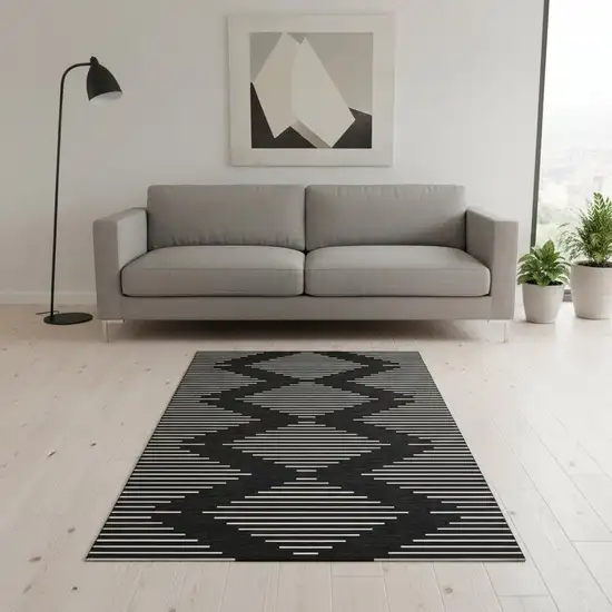 Black And Ivory Geometric Washable Area Rug With UV Protection Photo 2