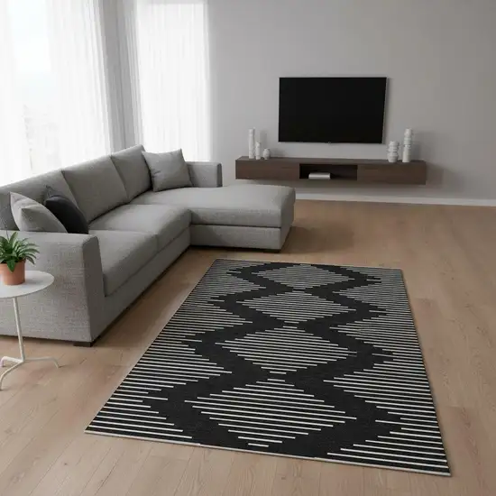 Black And Ivory Geometric Washable Area Rug With UV Protection Photo 2