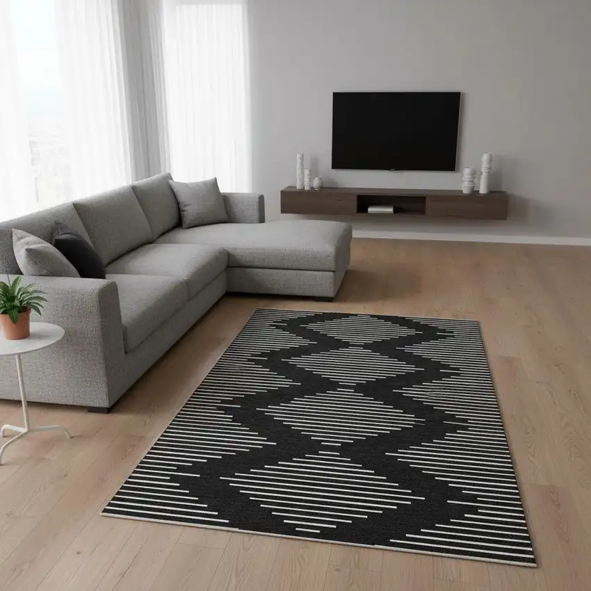 Black And Ivory Geometric Washable Area Rug With UV Protection Photo 2