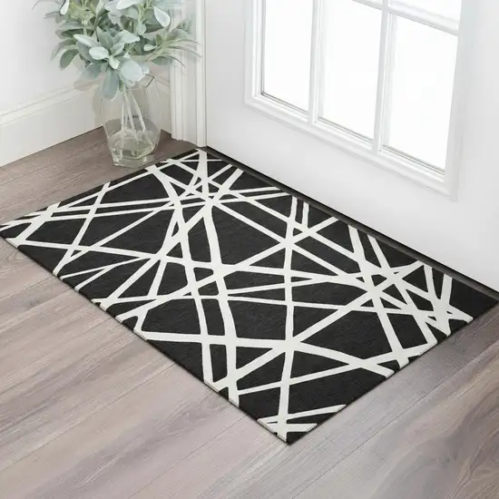 Black And Ivory Geometric Washable Area Rug With UV Protection Photo 2