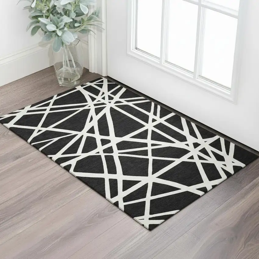 Black And Ivory Geometric Washable Area Rug With UV Protection Photo 2