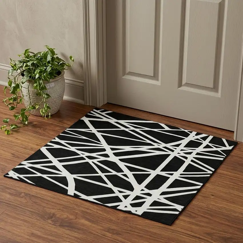 Black And Ivory Geometric Washable Area Rug With UV Protection Photo 1