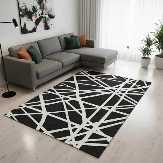 Black And Ivory Geometric Washable Area Rug With UV Protection Photo 2