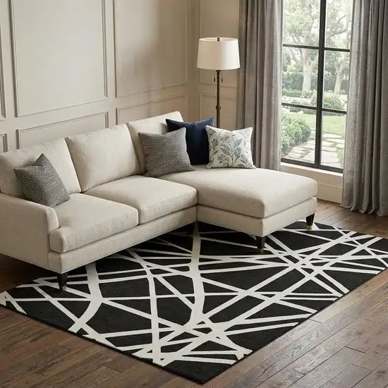 Black And Ivory Geometric Washable Area Rug With UV Protection Photo 1