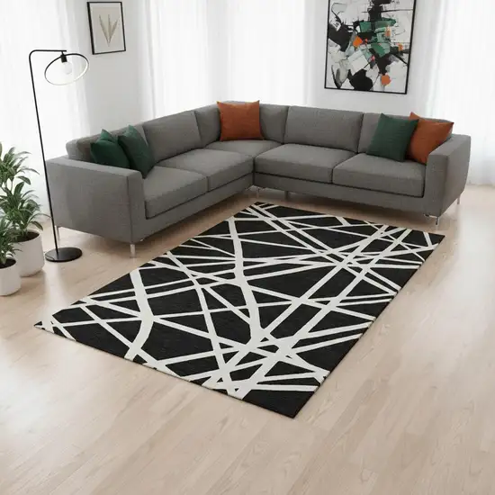 Black And Ivory Geometric Washable Area Rug With UV Protection Photo 2