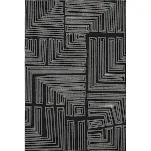 Photo of Black And Ivory Geometric Washable Area Rug With UV Protection
