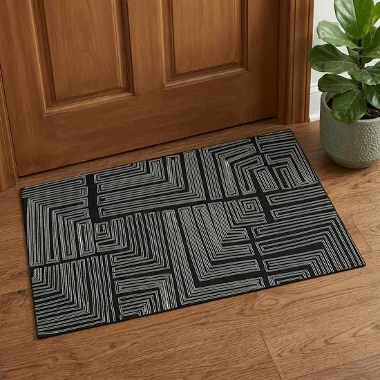 Black And Ivory Geometric Washable Area Rug With UV Protection Photo 1