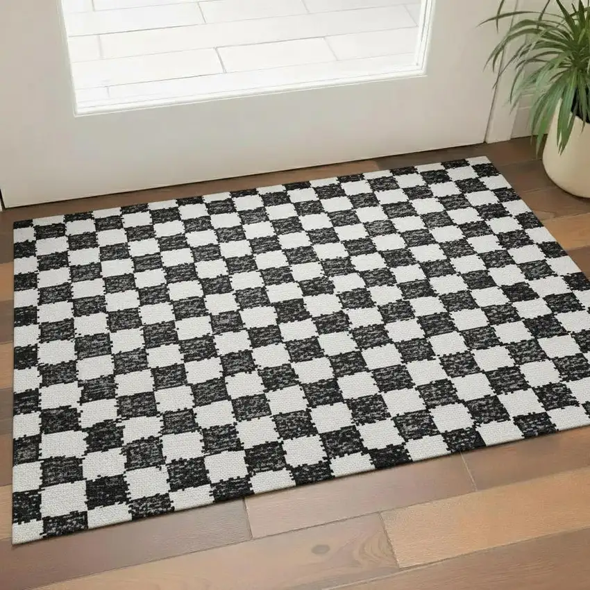 Black And Ivory Geometric Washable Area Rug With UV Protection Photo 2