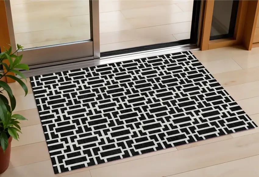 Black And Ivory Geometric Washable Indoor Outdoor Area Rug Photo 1