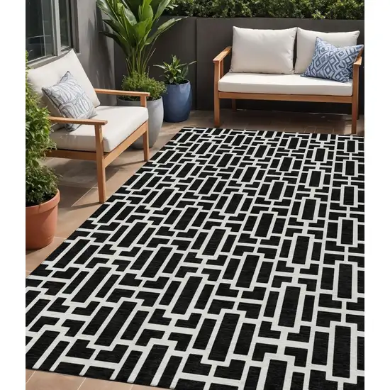 Black And Ivory Geometric Washable Indoor Outdoor Area Rug Photo 1