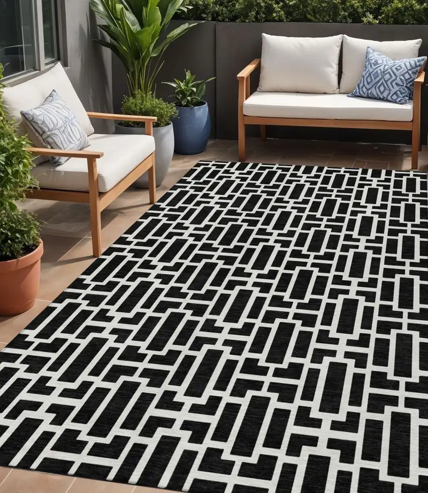 Black And Ivory Geometric Washable Indoor Outdoor Area Rug Photo 1