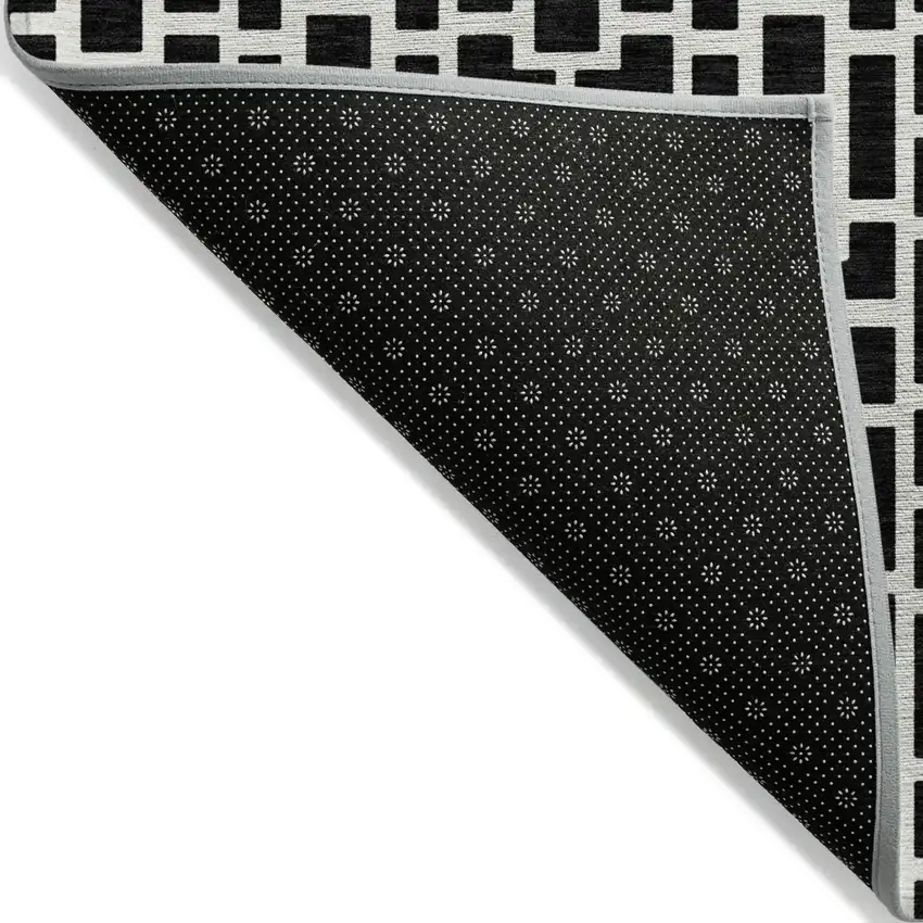 Black And Ivory Geometric Washable Indoor Outdoor Area Rug Photo 4