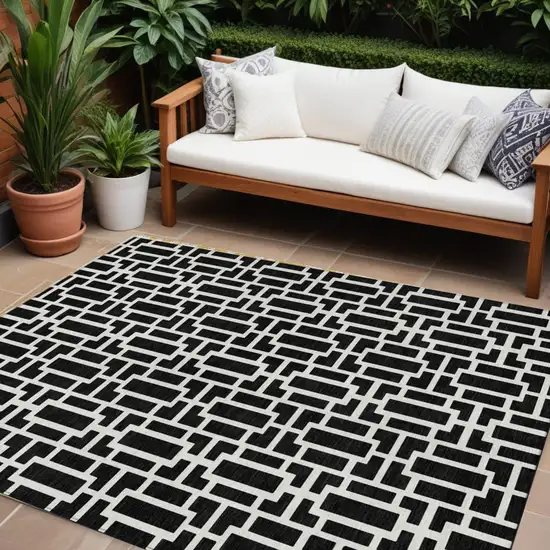 Black And Ivory Geometric Washable Indoor Outdoor Area Rug Photo 1