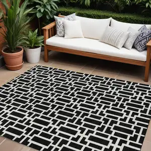 Photo of Black And Ivory Geometric Washable Indoor Outdoor Area Rug