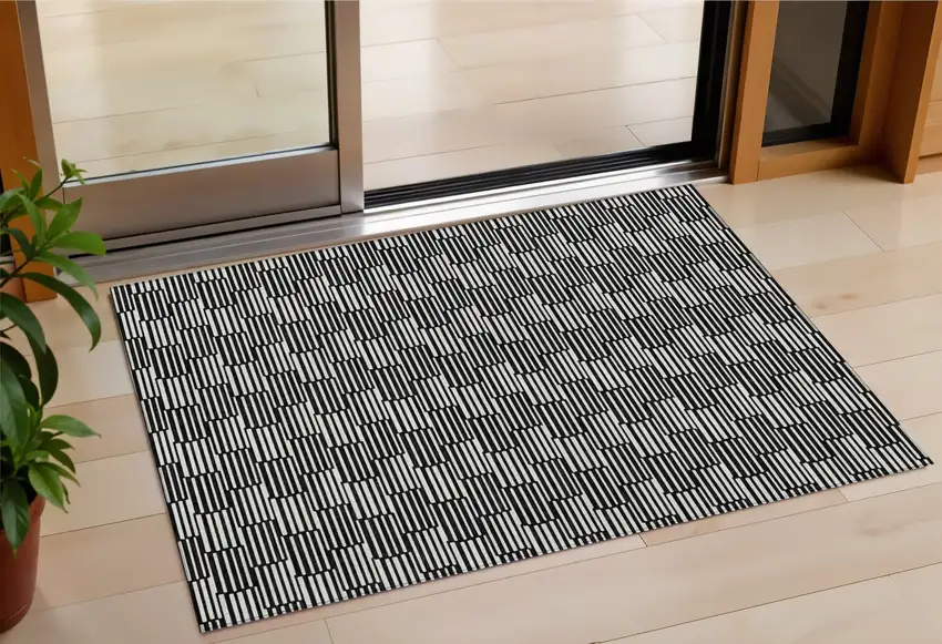 Black And Ivory Geometric Washable Indoor Outdoor Area Rug Photo 1