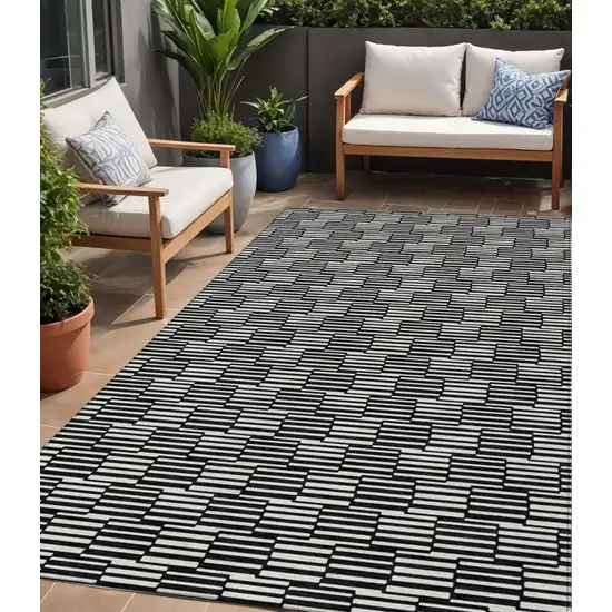 Black And Ivory Geometric Washable Indoor Outdoor Area Rug Photo 1