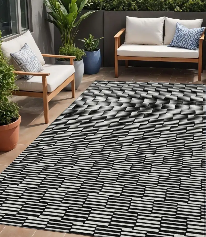 Black And Ivory Geometric Washable Indoor Outdoor Area Rug Photo 1