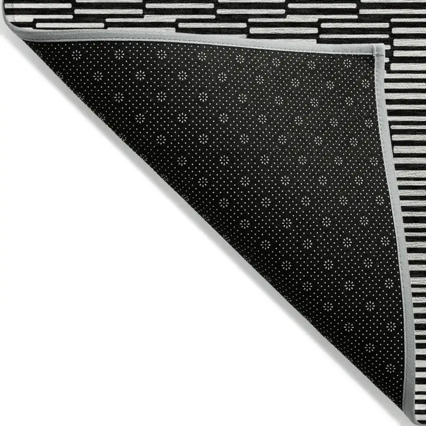Black And Ivory Geometric Washable Indoor Outdoor Area Rug Photo 4
