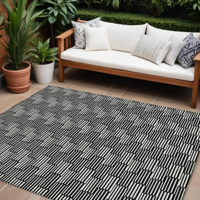 Black And Ivory Geometric Washable Indoor Outdoor Area Rug Photo 1