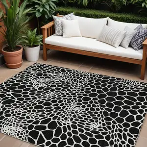 Photo of Black And Ivory Geometric Washable Indoor Outdoor Area Rug