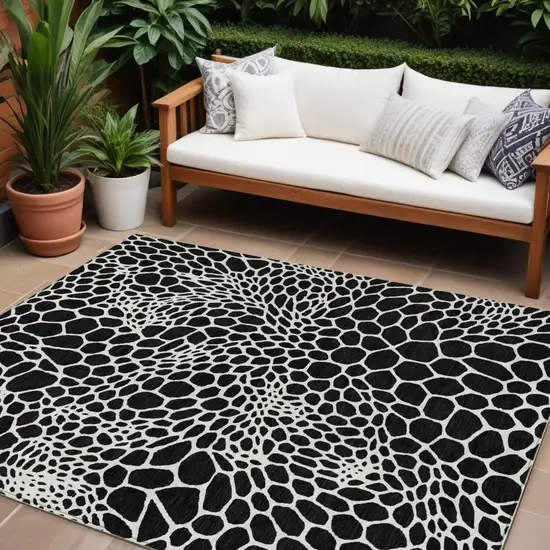 Black And Ivory Geometric Washable Indoor Outdoor Area Rug Photo 1