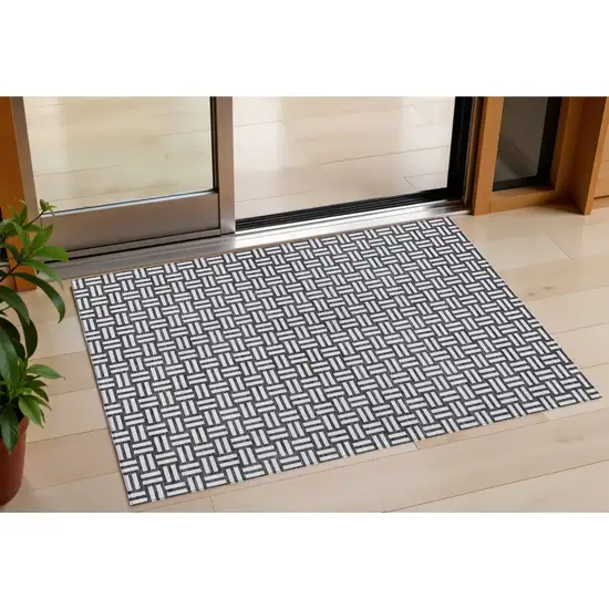 Black And Ivory Geometric Washable Indoor Outdoor Area Rug Photo 1