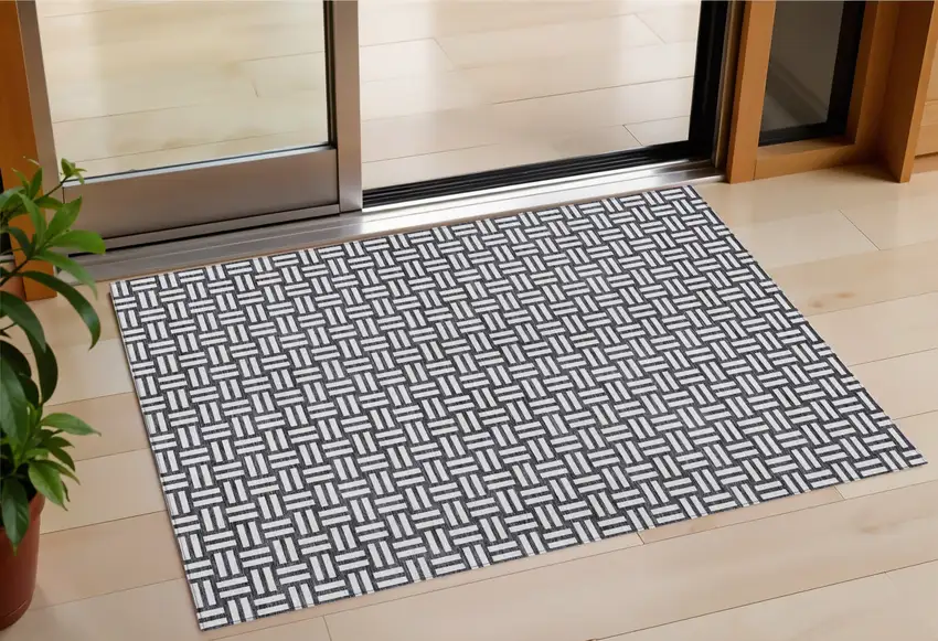 Black And Ivory Geometric Washable Indoor Outdoor Area Rug Photo 1