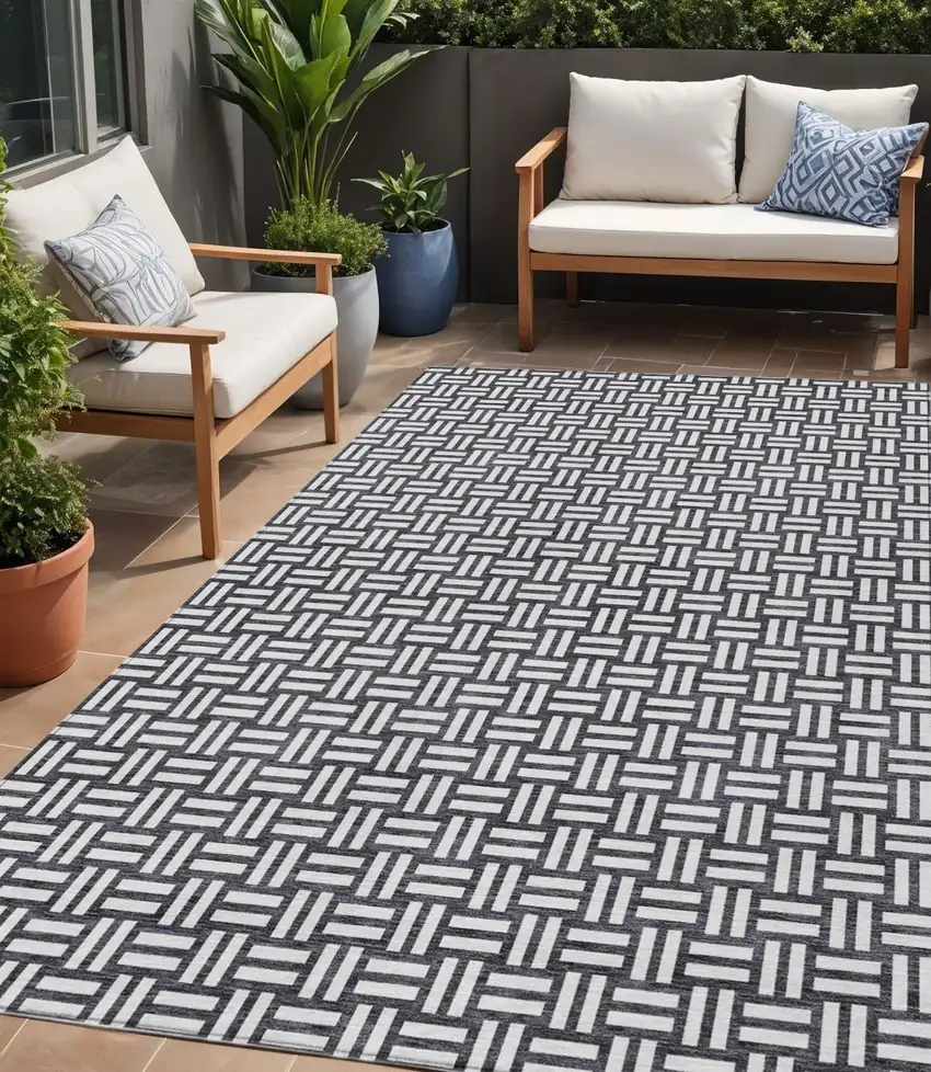 Black And Ivory Geometric Washable Indoor Outdoor Area Rug Photo 1