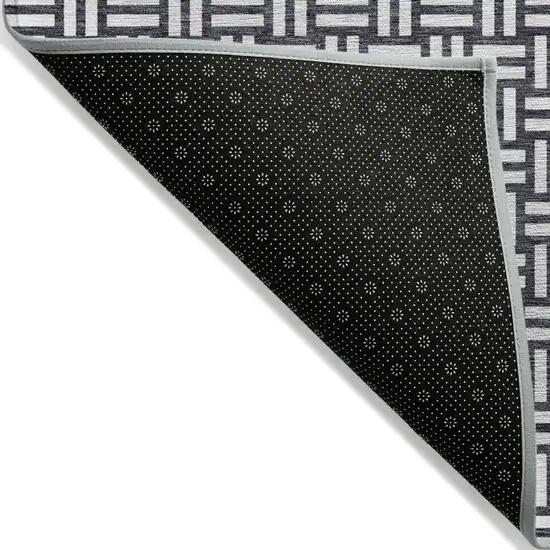 Black And Ivory Geometric Washable Indoor Outdoor Area Rug Photo 4