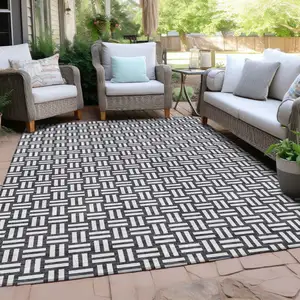 Photo of Black And Ivory Geometric Washable Indoor Outdoor Area Rug
