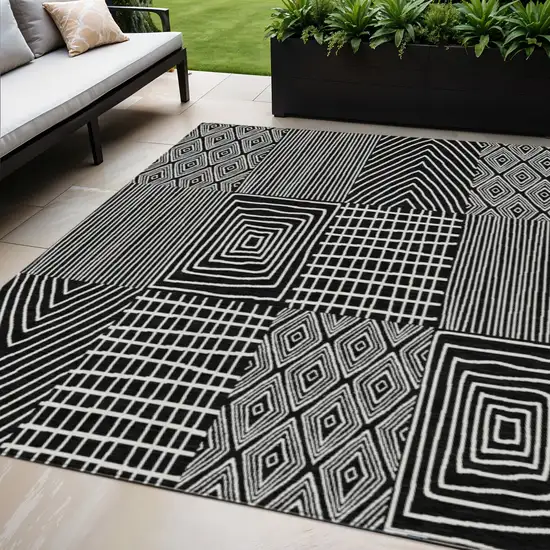 Black And Ivory Geometric Washable Indoor Outdoor Area Rug Photo 1