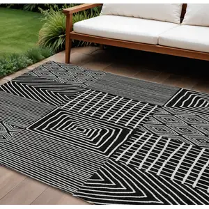 Photo of Black And Ivory Geometric Washable Indoor Outdoor Area Rug