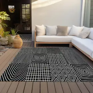 Photo of Black And Ivory Geometric Washable Indoor Outdoor Area Rug