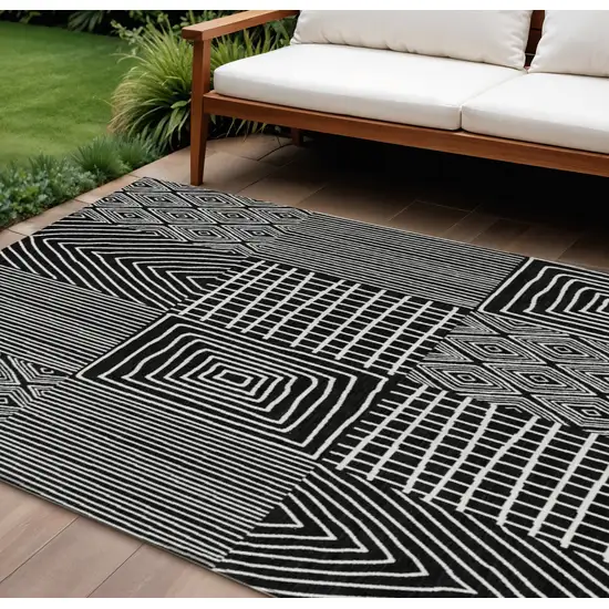 Black And Ivory Geometric Washable Indoor Outdoor Area Rug Photo 1