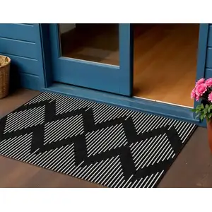 Photo of Black And Ivory Geometric Washable Indoor Outdoor Area Rug