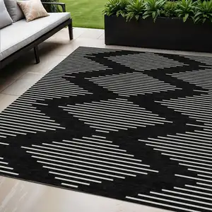 Photo of Black And Ivory Geometric Washable Indoor Outdoor Area Rug