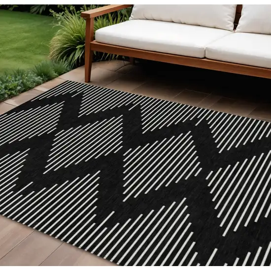 Black And Ivory Geometric Washable Indoor Outdoor Area Rug Photo 1