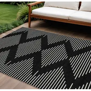 Photo of Black And Ivory Geometric Washable Indoor Outdoor Area Rug