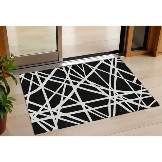 Black And Ivory Geometric Washable Indoor Outdoor Area Rug Photo 1